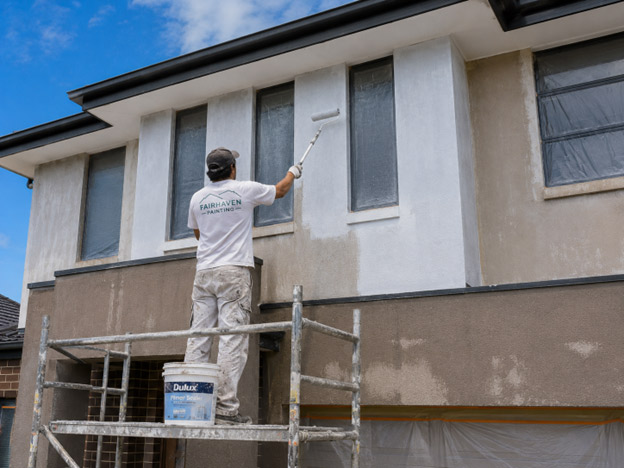 "Dulux Primer Sealer applied to rendered upper storey of brick veneer home in Grand Lakes Lara — exterior repaint preparation"